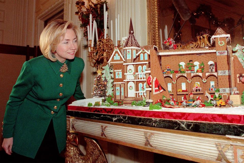 Hillary Clinton admires the White House gingerbread house, December 1997.