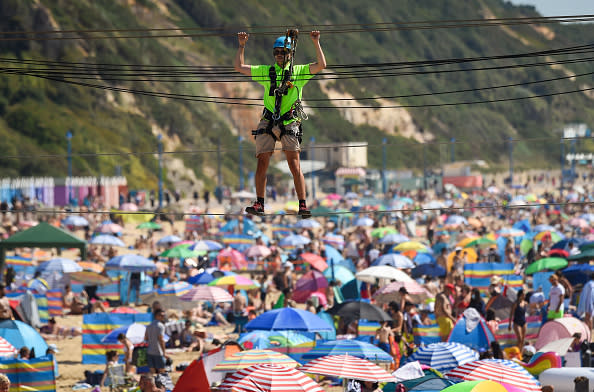 A worker prepares the zip line ride on the beach in Bournemouth, England. 
