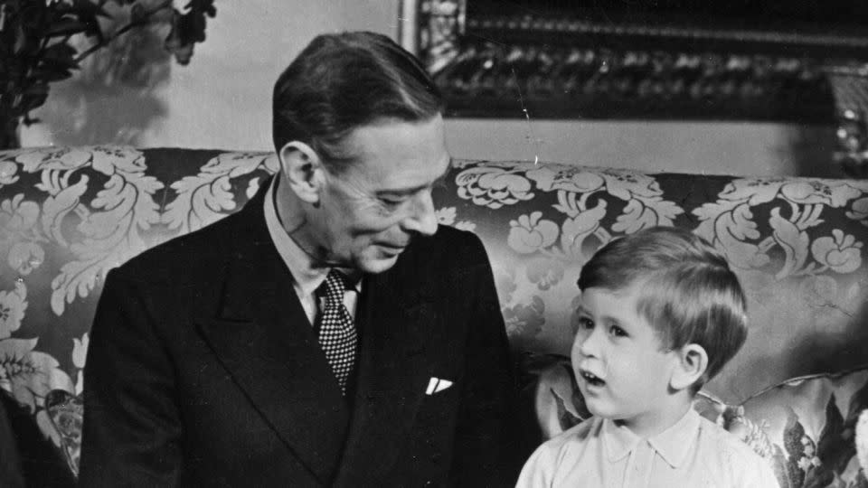 King George VI is pictured with his grandson, then Prince Charles, on his third birthday in 1951. - Topical Press Agency/Hulton Royals Collection/Getty Images