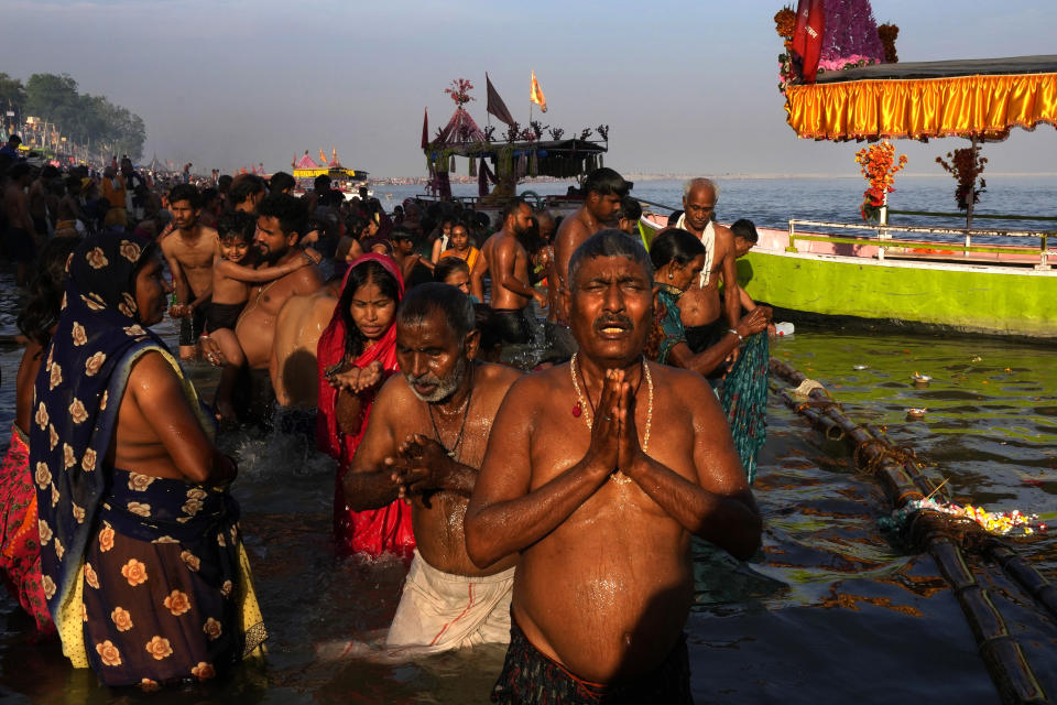 Thousands of Hindu devotees take a holy dip and pray on the occasion of Ramnavi festival, celebrated as the birthday of Hindu god Ram, in Ayodhya, India, March 30, 2023. India is on the cusp to eclipse China as the world's most populated country, but its religious fault lines have become starker, a testament to the perils of rising Hindu nationalism in a constitutionally secular country. (AP Photo/Manish Swarup)