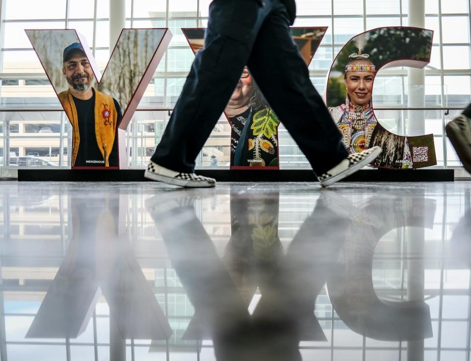 Faces of native Canadians appear on a "YYC" sign at Calgary International Airport in Calgary, Alta., Monday, Oct. 10, 2022. Calgary International (YYC) is the busiest airport in Alberta and the third-busiest in Canada by passenger traffic. 