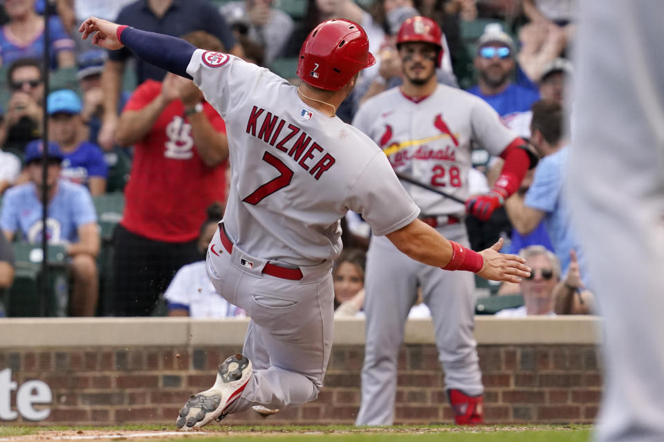 St. Louis Cardinals' Andrew Knizner (7) scores on a wild pitch from Chicago Cubs relief pitcher Codi Heuer during the ninth inning of a baseball game in Chicago, Sunday, Sept. 26, 2021. The St. Louis Cardinals won 4-2. (AP Photo/Nam Y. Huh)