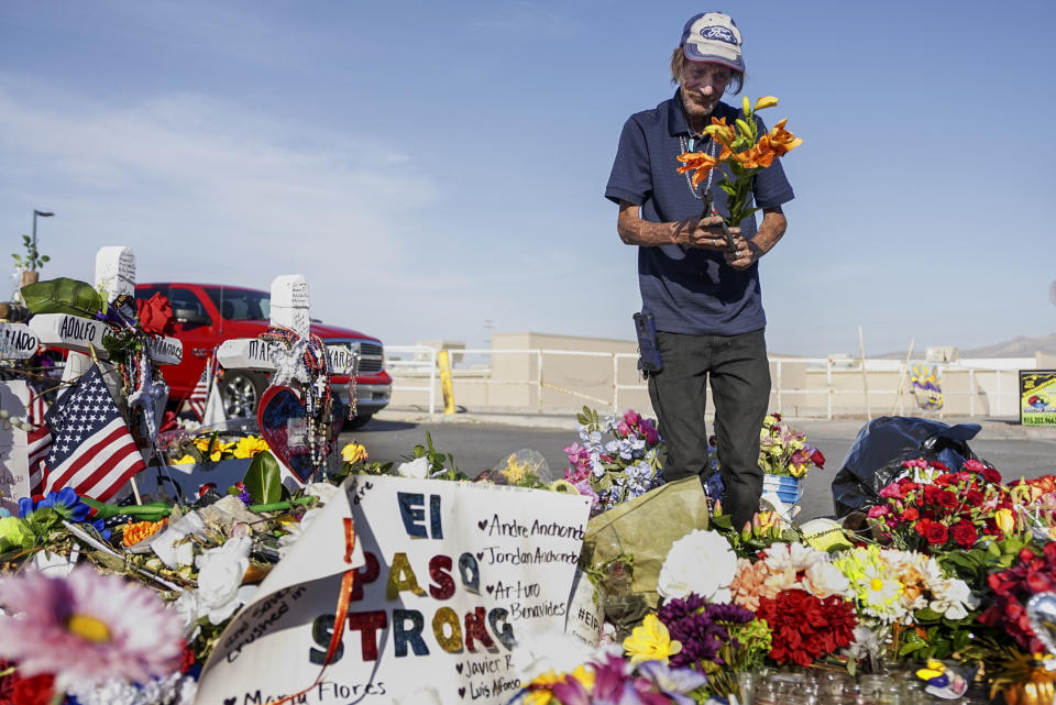 Antonio Basco, whose wife, Margie Reckard, was one of 22 killed by a gunman at a local Walmart, lays flowers in her honor at a makeshift memorial near the scene on August 16, 2019, in El Paso, Texas. (Photo: Sandy Huffaker via Getty Images)