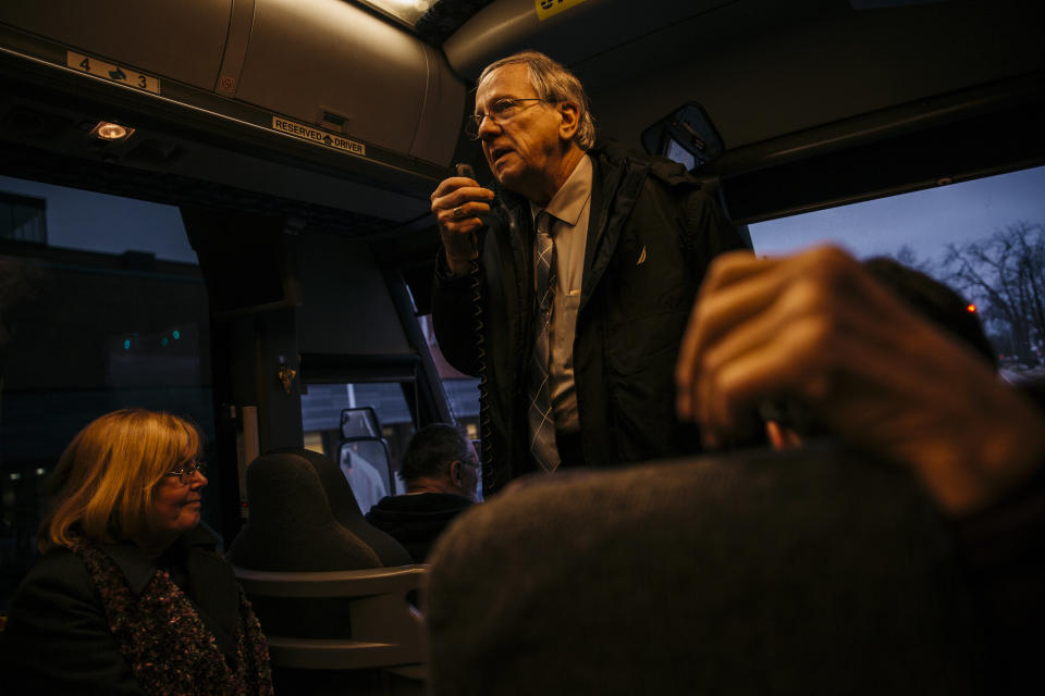 Gary Benjamin addresses the bus of about 30 people who traveled from Cleveland Heights, Ohio, to Ann Arbor, Michigan, after a continuance was issued in the hearing of detained asylum-seeker Ansly Damus. Benjamin and his wife, Melody Hart, were hoping that Damus would have been freed and allowed to travel back with them to Ohio, but he was remanded back into custody.