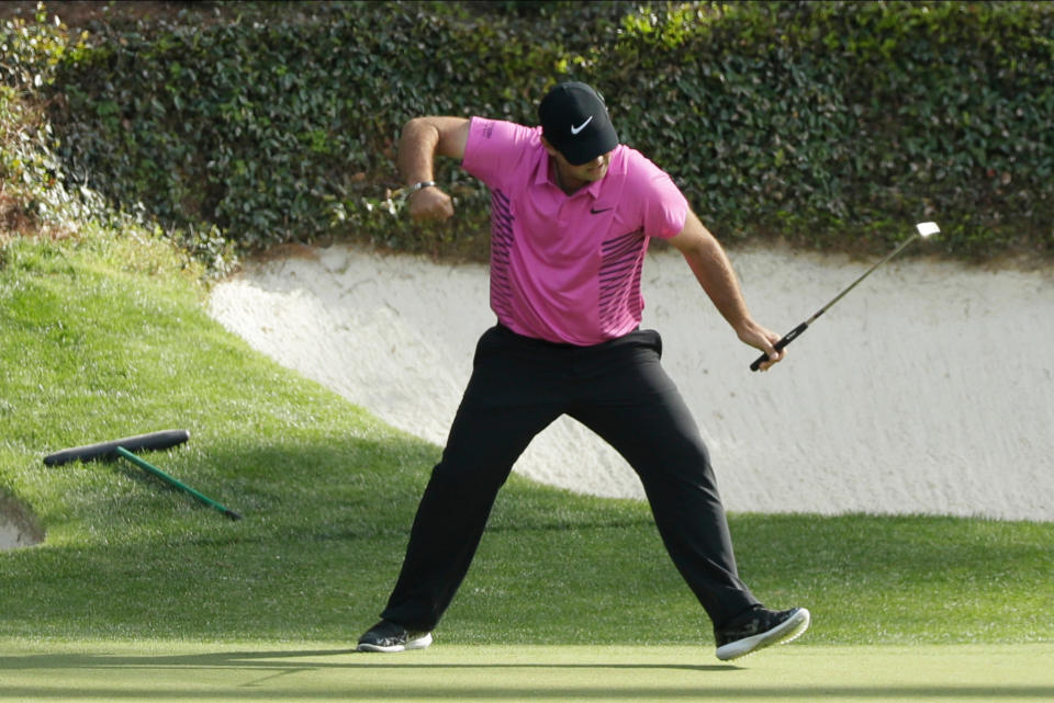 Patrick Reed reacts to his birdie on the 12th hole during the fourth round at the Masters. (AP)
