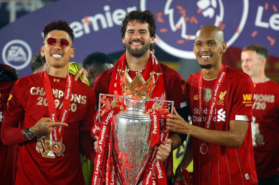 Firmino, Alisson and Fabinho with the Premier League trophy (2020 Pool)