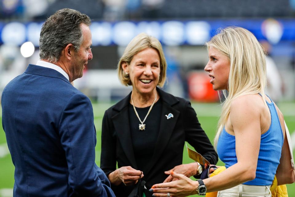 Kelly Stafford, wife of Matthew Stafford, talks to Lions principal owner Sheila Ford Hamp, center, and her husband Steve Hamp, before the game between the Rams and Lions at SoFi Stadium in Inglewood, Calif. on Oct. 24, 2021.