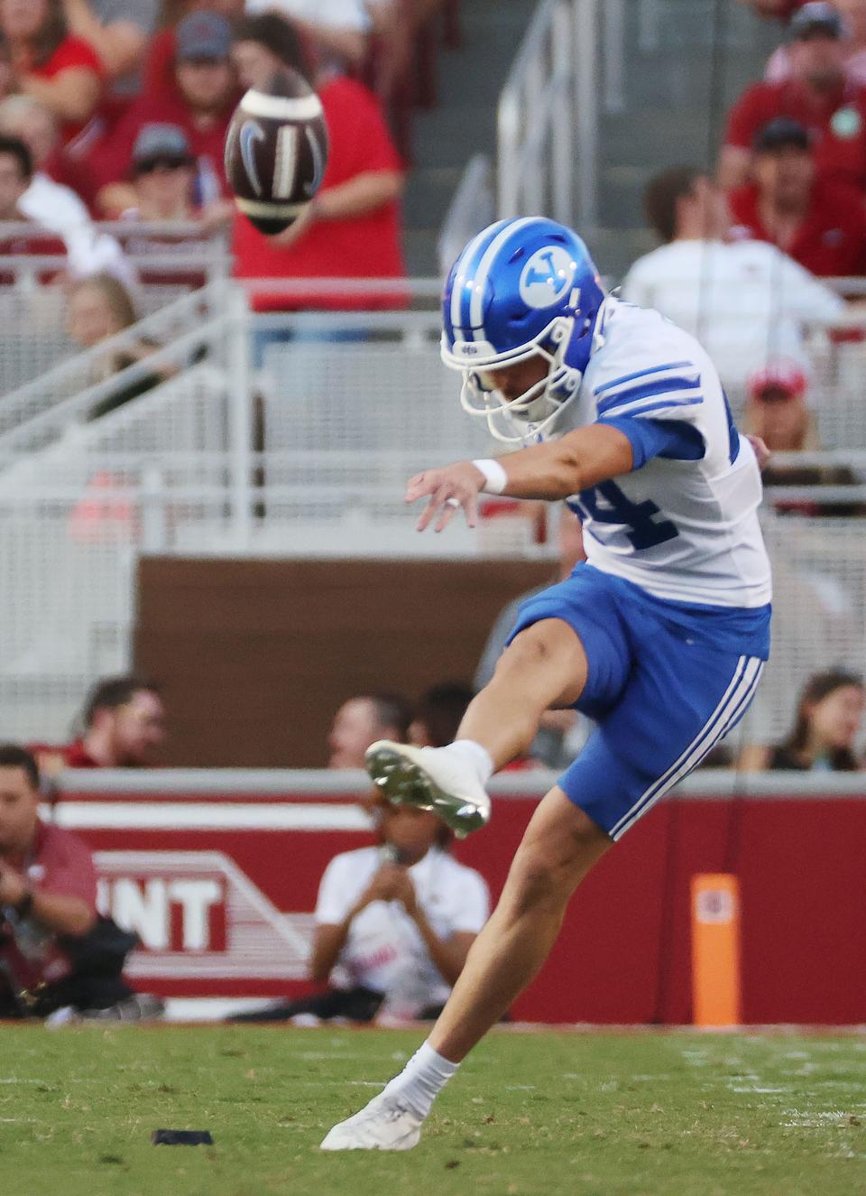 Brigham Young Cougars place kicker Will Ferrin (44) kicks off at Razorback Stadium in Fayetteville on Saturday, Sept. 16, 2023. | Jeffrey D. Allred, Deseret News