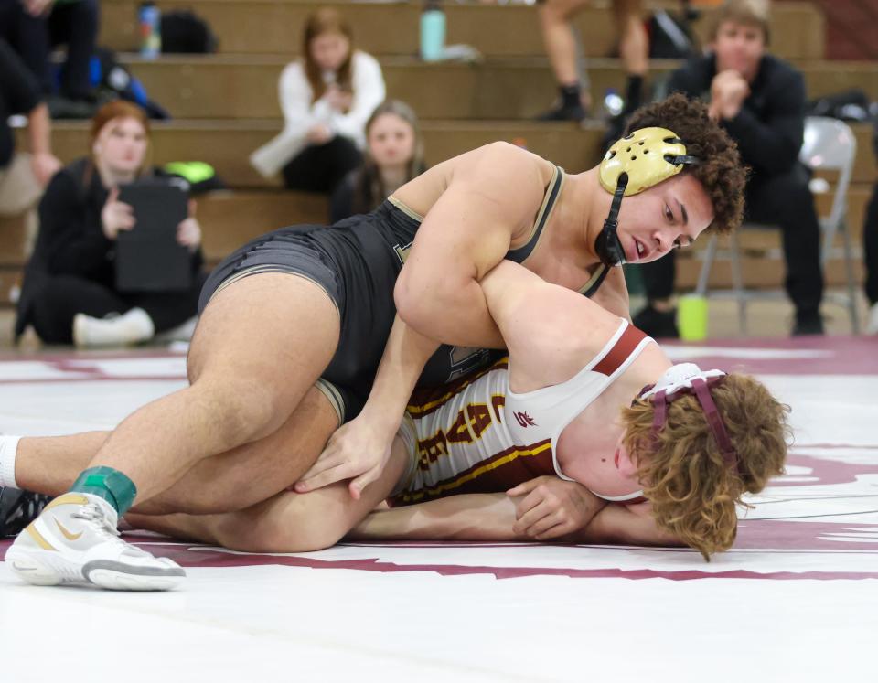 Vincent Freeman of Penn wrestles Caiden Williams of Mishawaka at 182lbs during the IHSAA Wrestling Sectionals Saturday, Jan. 28, 2023 at Mishawaka High School.