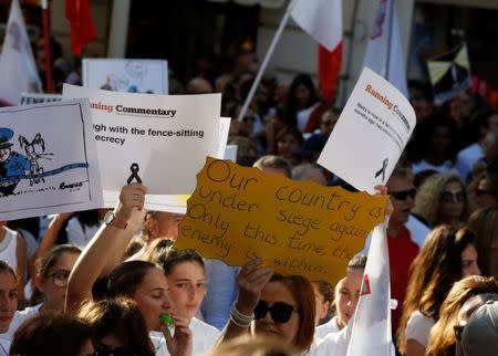 People protest against the assassination of investigative journalist Daphne Caruana Galizia last Monday, in Valletta, Malta, October 22, 2017. REUTERS/Darrin Zammit Lupi