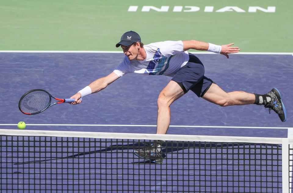 Andy Murray reaches for a shot near the net during his match against Taro Daniel at the BNP Paribas Open in Indian Wells, Calif., March 11, 2022.