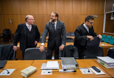 Lawyers Hannes Linke, Robert Kain and Thomas Koblenzer (L-R) of Swiss man Daniel M., accused of spying on a German tax authority to find out how it obtained details of secret Swiss bank accounts set up by Germans to avoid tax, arrive for the start of Daniel M's trial on espionage charges, in the Higher Regional Court in Frankfurt am Main, Germany October 18, 2017. REUTERS Andreas Arnold/Pool