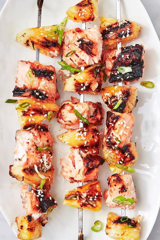 <p><a href="https://www.delish.com/uk/cooking/recipes/a29771277/pineapple-salmon-sheet-pan-dinner-recipe/" rel="nofollow noopener" target="_blank" data-ylk="slk:Pineapple and salmon;elm:context_link;itc:0;sec:content-canvas" class="link ">Pineapple and salmon</a> are a match made in heaven. Smoky, sweet, and just a little spicy, these skewers are a major crowd-pleaser. Make them for your next barbecue, and watch them disappear.</p><p>Get the <a href="https://www.delish.com/uk/cooking/recipes/a32399432/pineapple-salmon-skewers-recipe/" rel="nofollow noopener" target="_blank" data-ylk="slk:Pineapple Salmon Skewers;elm:context_link;itc:0;sec:content-canvas" class="link ">Pineapple Salmon Skewers</a> recipe.</p>