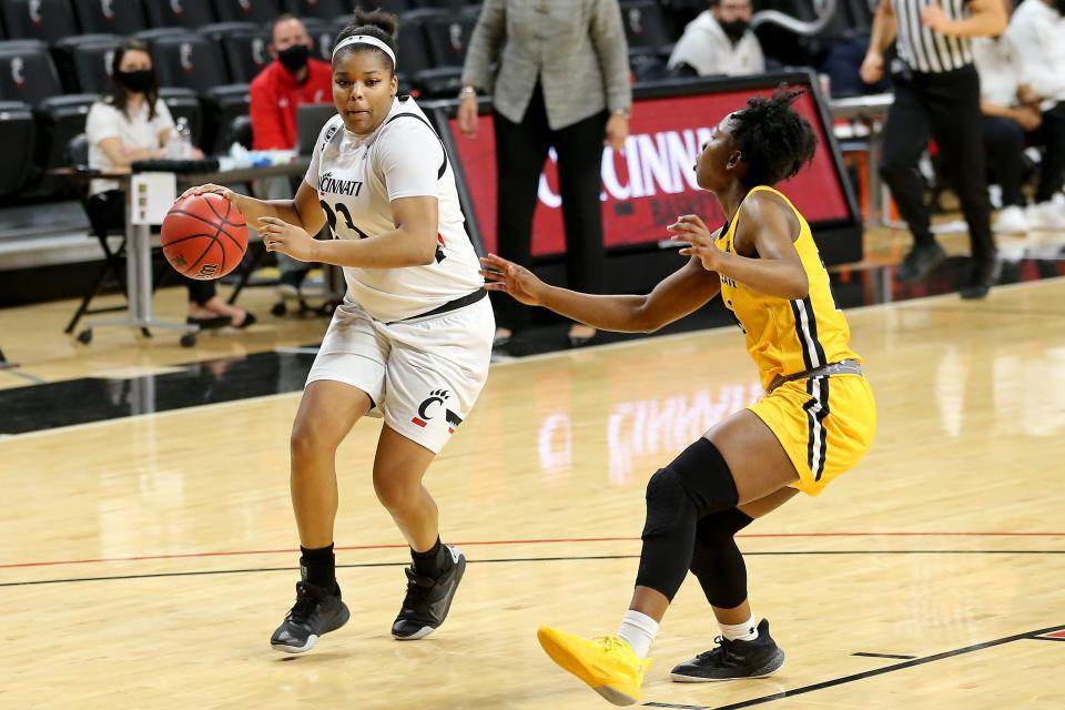 Cincinnati forward IImar'I Thomas (23), driving to the basket in a game against Wichita State in 2021, is one of the best women's basketball players to put on a Bearcat uniform.