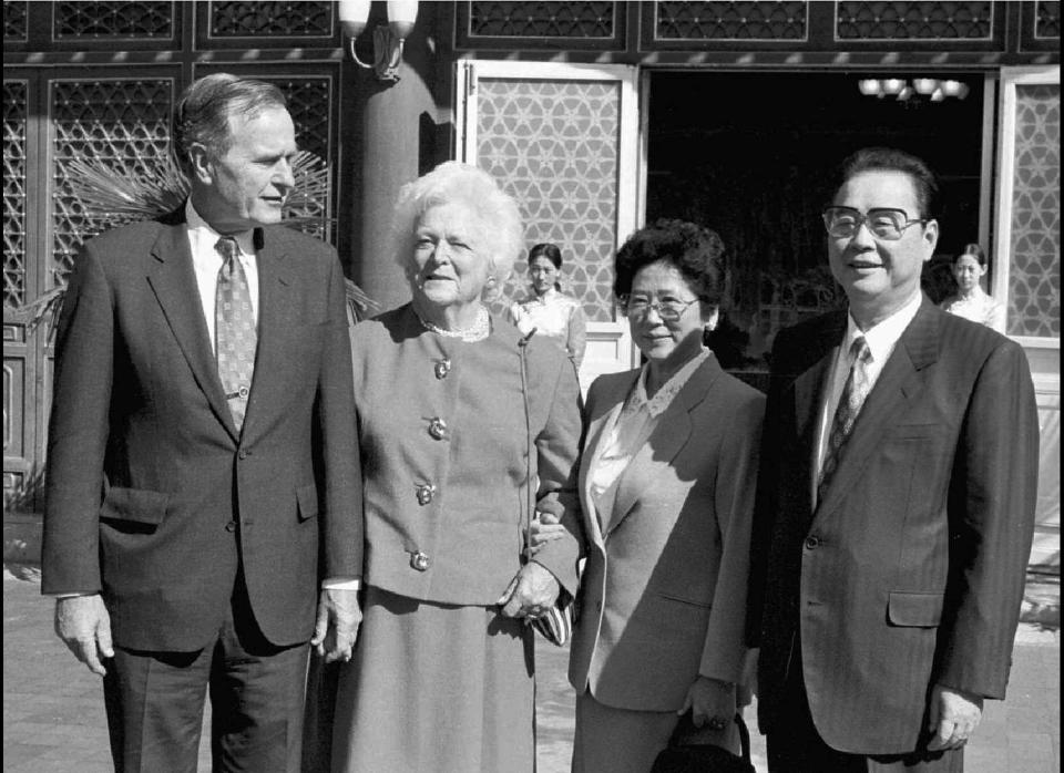 Former President George Bush, left, and wife Barbara pose with Chinese Premier Li Peng, right, and his wife Zhu Lin after meeting at the Zhongnanhai State Guest House in Beijing Monday Sept. 11, 1995. The Clinton administration should patch up relations with China through quiet diplomacy and promote its transformation into an economic power, Bush said at the time.