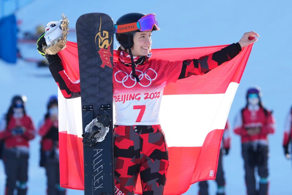 Silver medalist Daniela Ulbing (AUT) celebrates on the podium during the snowboard parallel giant slalom during the Beijing 2022 Olympic Winter Games at Genting Snow Park on Feb 8, 2022.