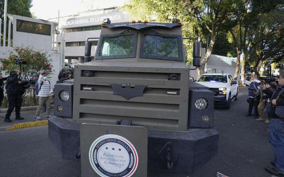 An armored transport drives out of the prosecutor's building where Ovidio Guzmán, one of the sons of former Sinaloa cartel boss Joaquin "El Chapo" Guzmán, is in custody in Mexico City, Thursday, Jan. 5, 2023. The Mexican military has captured Ovidio Guzman during a operation outside Culiacan, a stronghold of the Sinaloa drug cartel in western Mexico. (AP Photo/Fernando Llano)