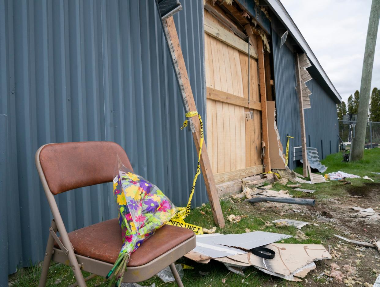 Flowers were left at a scene on Sunday, April 21, 2024, where an alleged drunken driver smashed through a wall at the Swan Boat Club during a child’s birthday party in Newport on Saturday.