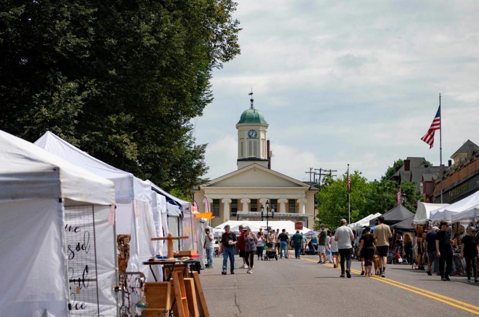 Visitors browse the booths along High Street for the 39th Annual Bellefonte Arts and Crafts Fair on Friday, Aug. 5, 2022.