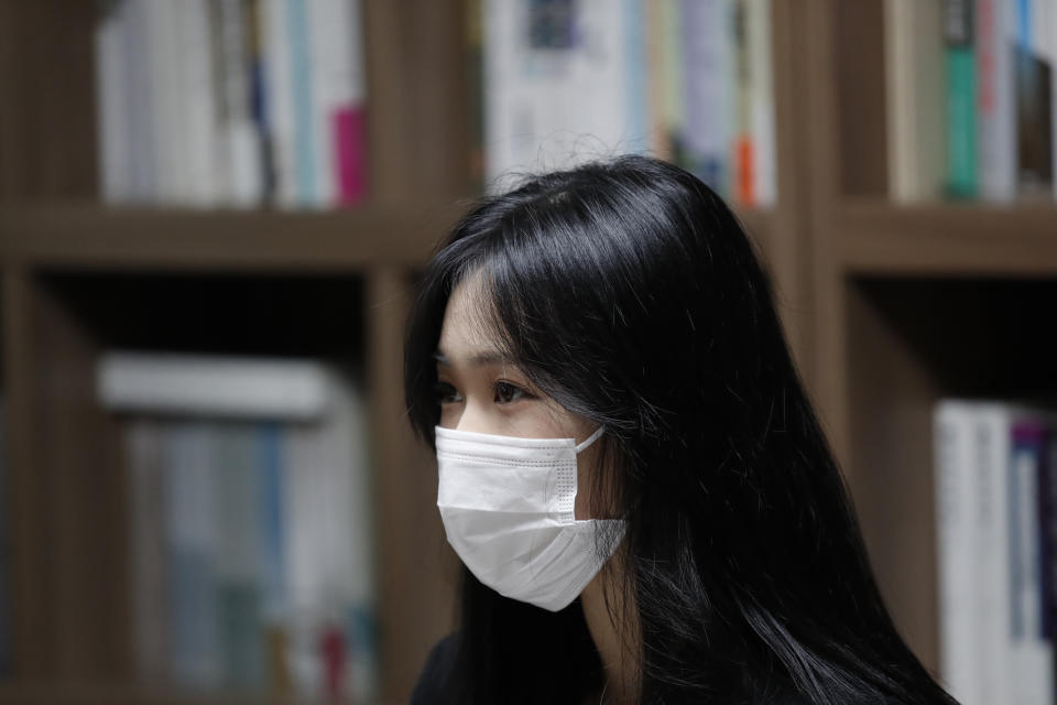 Han Shin Bi, a high school senior in Seoul, wearing a face mask speaks during an interview in Seoul, South Korea, on Sept. 18, 2020. “Online classes were really inconvenient,” said Han. Experts say the reduced interaction with teachers, digital distractions and technical difficulties are widening the education achievement gap among students in South Korea, leaving those less well off, like Han, at even more at a disadvantage. (AP Photo/Lee Jin-man)