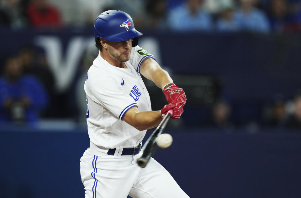 Toronto Blue Jays' Ernie Clement hits an RBI single against the Kansas City Royals during the seventh inning of a baseball game Friday, Sept. 8, 2023, in Toronto. (Nathan Denette/The Canadian Press via AP)