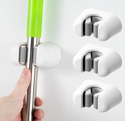 Save £6 on this pack of three wall-mounted broom and mop grippers