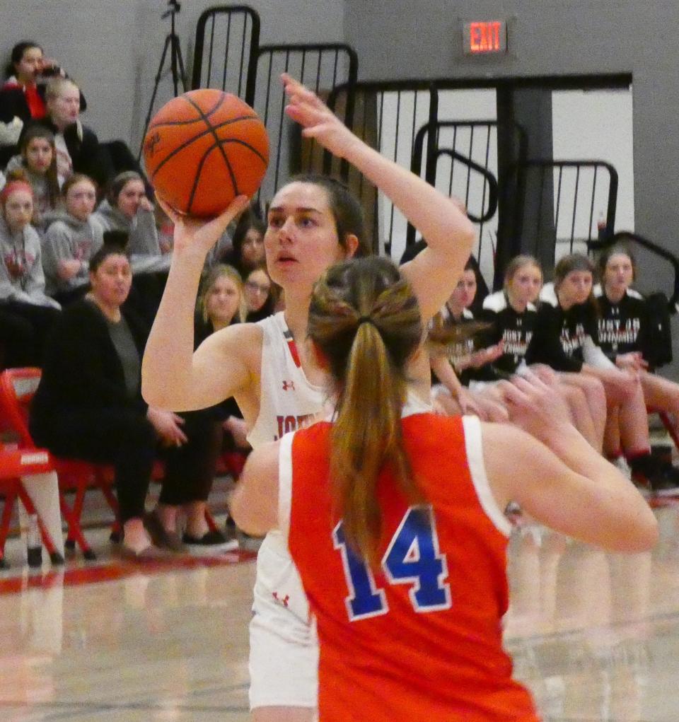 Johnstown senior Brooke Barb takes a 3-pointer as Licking Valley senior Tori Mooney closes out on Wednesday, Jan. 26, 2022. Barb hit four 3-pointers for the Johnnies in a 56-46 victory against the visiting Panthers.