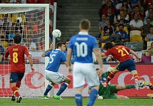 Spain midfielder David Silva (right) gets ahead of Italy defender Andrea Barzagli (C) to score with a header during the Euro 2012 final at the Olympic Stadium in Kiev on July 1. Spain beat Italy 4-0 to successfully defend their title