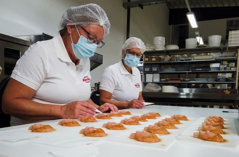 German confectioners produce Marzipan cookies depicting German Chancellor Merkel, ahead of the September 26 elections, in Weilbach