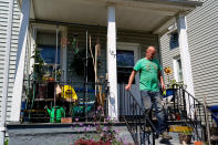 Marshal Staufenberger, whose former neighbor Kat Massey was among the victims at a shooting at a supermarket, steps out of his home in Buffalo, N.Y., Sunday, May 15, 2022. (AP Photo/Matt Rourke)