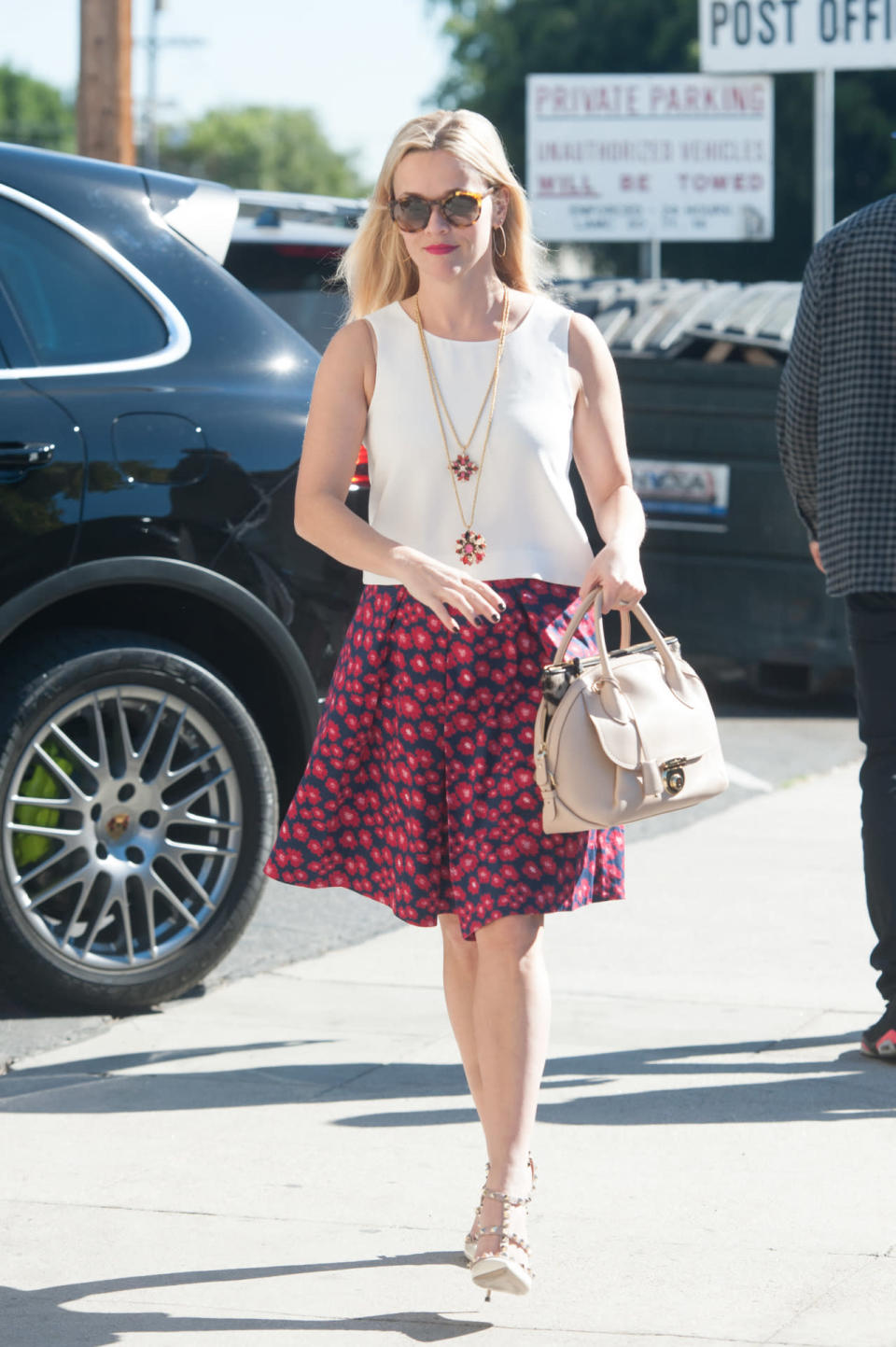 Reese Witherspoon wears a white shell top and floral skirt on Nov. 19, 2015 in Los Angeles, California. 
