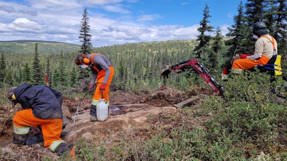 Workers stipping outcrop