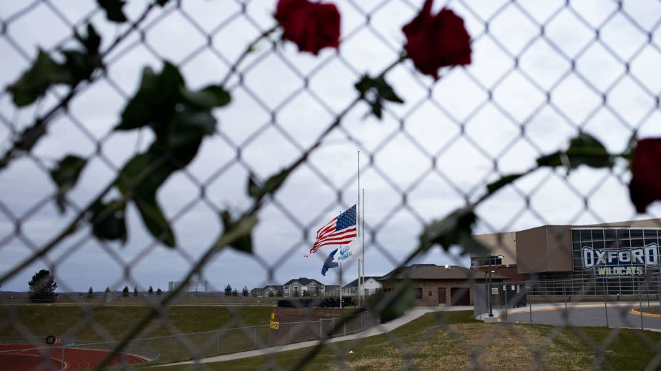 Roses hang from a fence to honor the victims of the shooting at Oxford High School on December 7, 2021 in Oxford, Michigan. - Emily Elconin/Getty Images