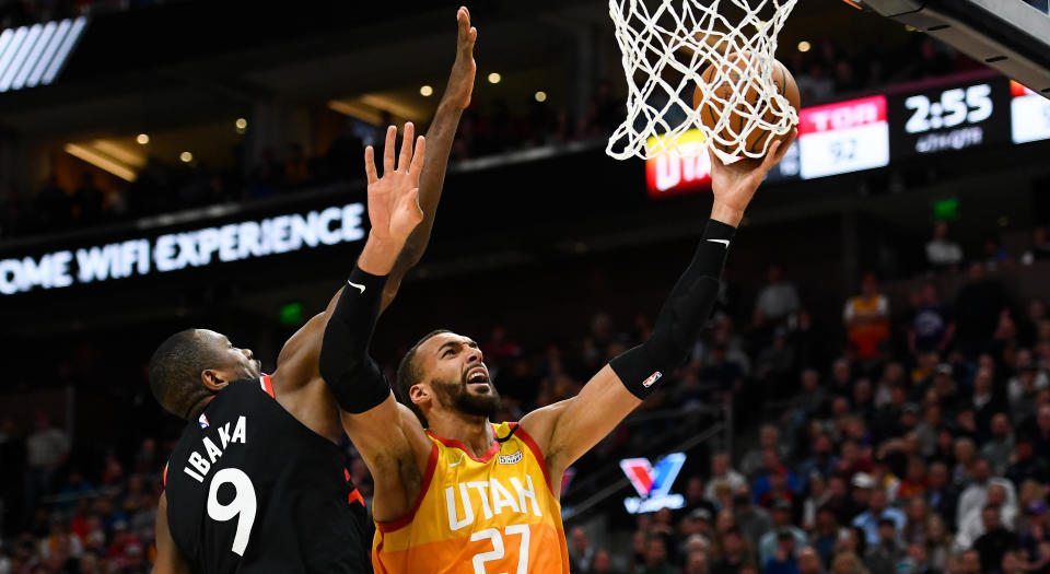 Serge Ibaka of the Toronto Raptors (left) has not contracted the coronavirus after guarding Rudy Gobert of the Utah Jazz in an NBA game on Monday. (Photo by Alex Goodlett/Getty Images)