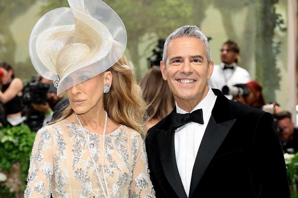 <p>Dimitrios Kambouris/Getty</p> Sarah Jessica Parker and Andy Cohen on May 6, 2024, at the Met Gala
