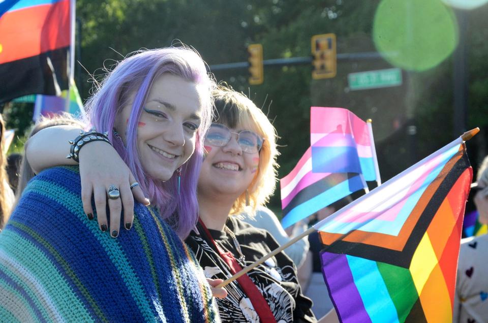 Juneau Simon (left) and River Holt take part in the sixth annual Petoskey Pride Walk on Sunday, June 30, 2024.