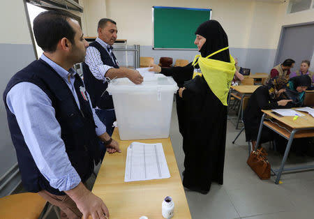 A woman supporter of Hezbollah casts her vote at a polling station during the parliamentary election in Tibnin, South Lebanon, May 6, 2018. REUTERS/Aziz Taher