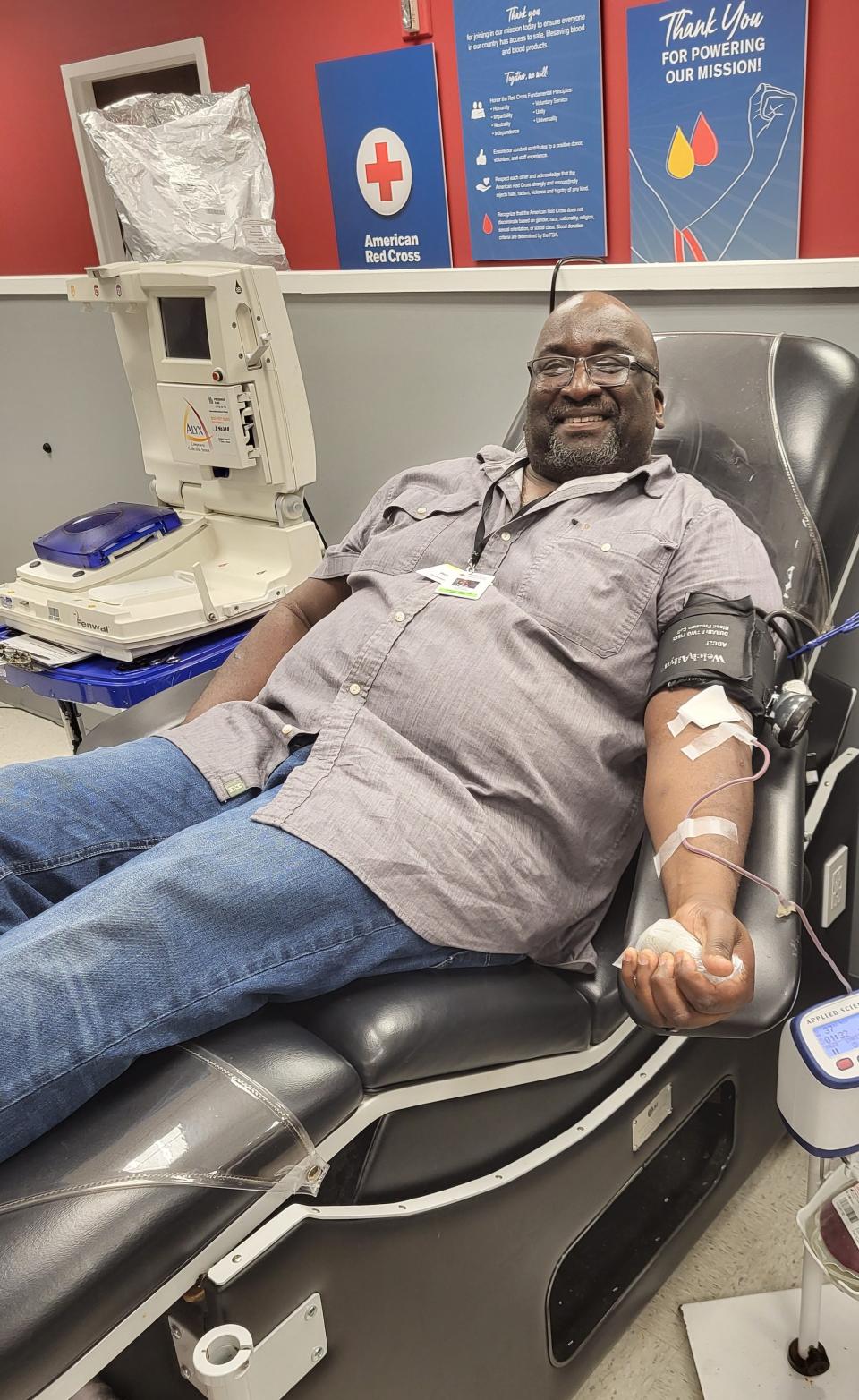 Blood donor elated to donate blood to the American Red Cross. The Red Cross seeks African American blood donors to help those with sickle cell disease get their blood transfusions.