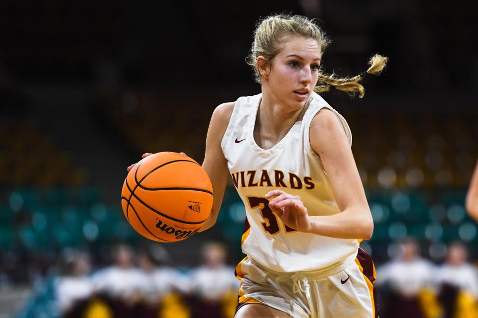 Windsor girls basketball player Sam Darnell drives to the basket against Mead during the quarterfinals of the Colorado 5A state basketball tournament on March 2 at the Denver Coliseum.