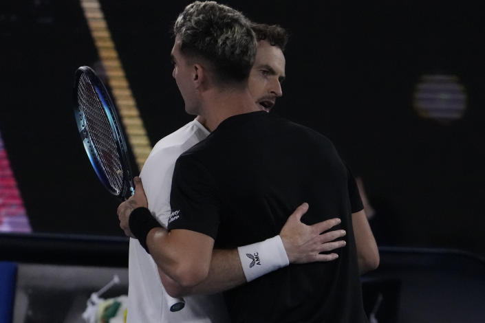 Andy Murray of Britain at left hugs Thanasi Kokkinakis of Australia after defeating him at the Australian Open tennis championship in Melbourne, Australia, Friday, Jan. 20, 2023. (AP Photo/Ng Han Guan)