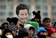 FILE - Fans hold an image of Shaun White, of the United States, prior to the start of the men's halfpipe finals at Phoenix Snow Park at the 2018 Winter Olympics in Pyeongchang, South Korea, Feb. 14, 2018. The Beijing Olympics will be the fifth Olympics for the three-time gold medalist. And the last Olympics for the 35-year-old — get this — elder-statesman who is now more than double the age of some of the riders he goes against. (AP Photo/Gregory Bull, File)