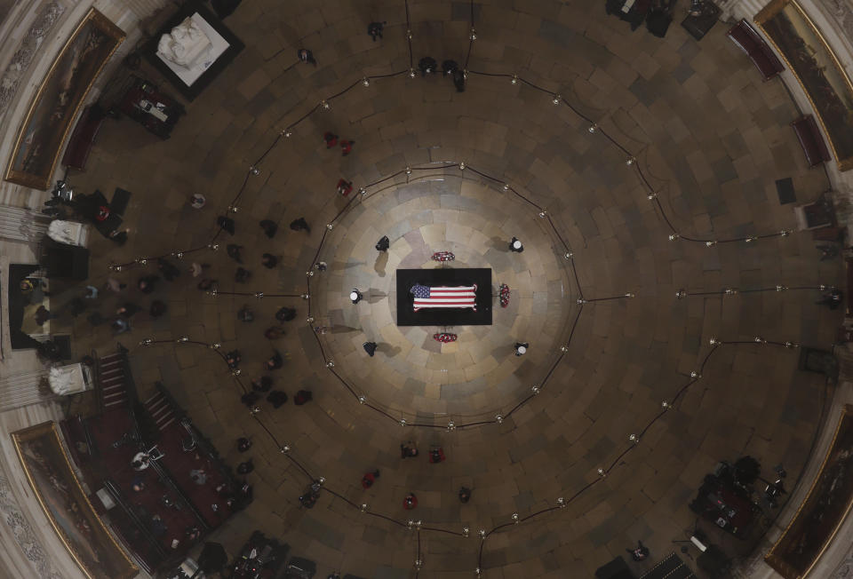 Members of the public are seen inside the Capitol Rotunda as former President George H.W. Bush lies in state on Wednesday ahead of his memorial service.&nbsp; (Photo: ASSOCIATED PRESS)