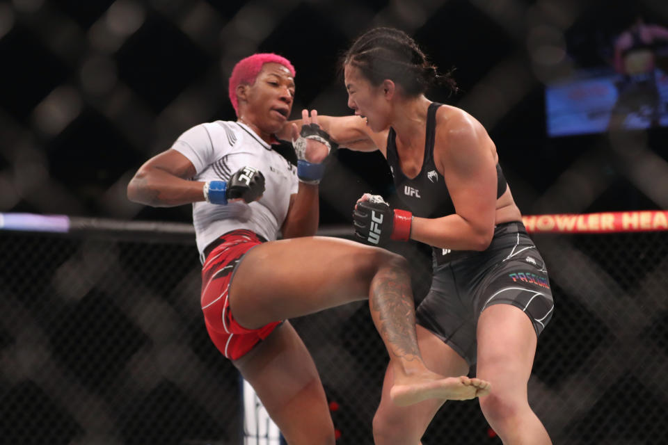 Jun 12, 2022; Singapore, SIN; Ramona (red gloves) fights Jocelyn Edwards (blue gloves) during UFC 275 at Singapore Indoor Stadium. Mandatory Credit: Paul Miller-USA TODAY Sports