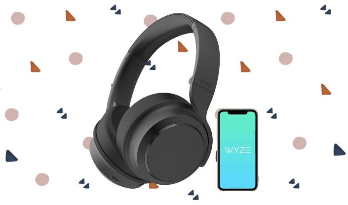 The Wyze Headphones are shown here with a phone, because the Wyze companion app allows you to adjust various settings.