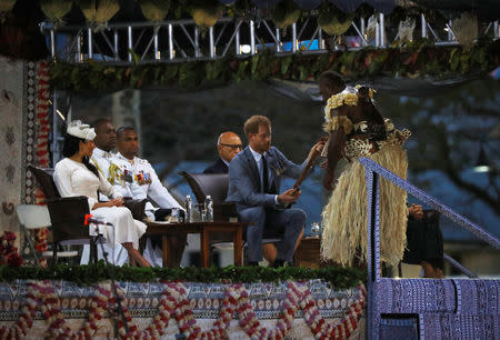 Britain’s Prince Harry and Meghan, the Duchess of Sussex attend an official welcome ceremony at Albert Park as they arrive in Suva, Fiji October 23, 2018. REUTERS/Phil Noble