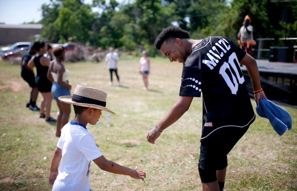 Chris "Twix" Shepard teaches Rashad Ross during Juneteenth on the East in Oklahoma City,Saturday, June 19, 2021. Shepard was with RACE Dance Collective.