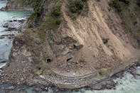 FILE - in this Nov. 14, 2016 file photo, an aerial photo shows the damage to a state highway near Kaikoura after a powerful earthquake hit New Zealand. The virus outbreak is compromising the ability of nations to prepare for natural disasters and deal with the aftermath. Every year, the world contends with devastating typhoons, wildfires, tsunamis and earthquakes. (David Alexander/SNPA via AP, File)