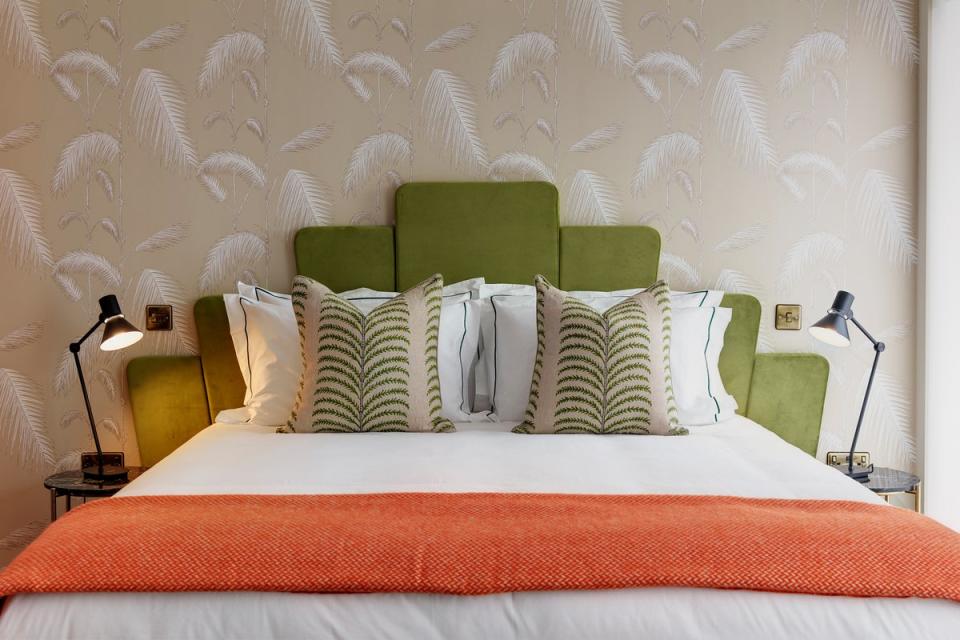 Apple-coloured flared panel headboards dress comfy double beds (Brama, Bromley)