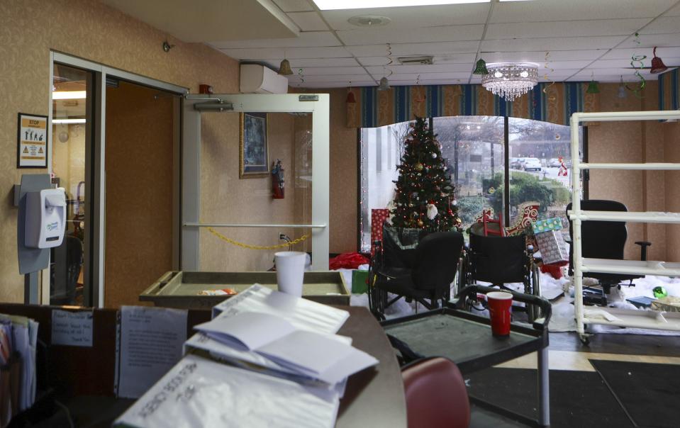 The front lobby of Northview Village Nursing Home is left in disarray in St. Louis on Saturday, Dec. 16, 2023. The living facility closed suddenly, much to the outrage of employees, volunteers and relatives of residents who returned to find their belongings and information of the whereabouts of loved ones. (Vanessa Abbitt/St. Louis Post-Dispatch via AP)