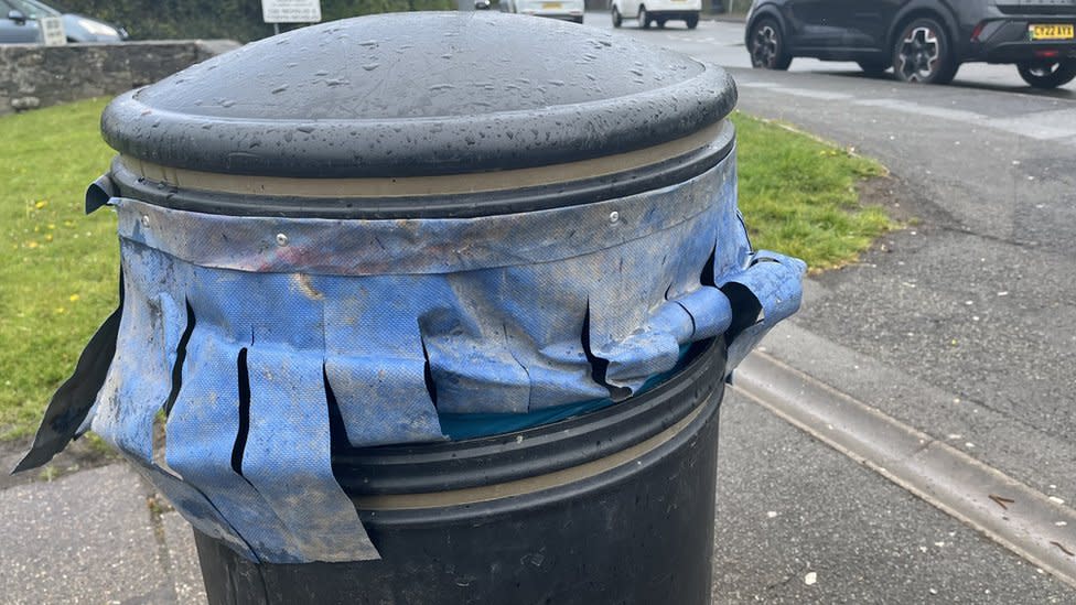 Bin with curtains